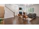 This living room features a fireplace, hardwood floors, and a sofa at 2467 Davis Se Dr, Smyrna, GA 30080