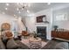 Cozy living room with a fireplace, stylish furnishings, and modern lighting, perfect for relaxing and entertaining at 2467 Davis Se Dr, Smyrna, GA 30080