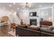 This living room features a fireplace, hardwood floors, and a sofa at 2467 Davis Se Dr, Smyrna, GA 30080