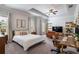Spacious main bedroom with a tray ceiling, plush carpeting, and abundant natural light, offering a serene retreat at 2467 Davis Se Dr, Smyrna, GA 30080