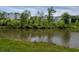 Peaceful pond view with ducks at the edge of grassy banks and houses in the background at 2467 Davis Se Dr, Smyrna, GA 30080