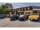 Charming restaurant exterior with a rustic design, outdoor seating, and ample parking available at 2467 Davis Se Dr, Smyrna, GA 30080