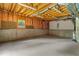 Unfinished basement with exposed beams, insulated walls, and concrete floor, ready for customization at 5510 Conway Dr, Marietta, GA 30068
