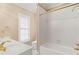 Bathroom with a combined shower and tub, a window, and a sink at 5510 Conway Dr, Marietta, GA 30068