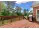 Spacious wooden deck, perfect for outdoor dining and relaxation, overlooks the landscaped backyard at 5510 Conway Dr, Marietta, GA 30068
