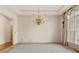 Dining room featuring tray ceiling, neutral decor, and chandelier lighting at 5510 Conway Dr, Marietta, GA 30068