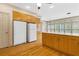 Spacious kitchen featuring wood cabinets, white appliances, and light countertops at 5510 Conway Dr, Marietta, GA 30068