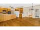 Open kitchen with light wood cabinets, white appliances, and hardwood flooring throughout at 5510 Conway Dr, Marietta, GA 30068