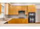 Well-equipped kitchen with gas range, black appliances, and light countertops at 5510 Conway Dr, Marietta, GA 30068