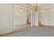 Bright, airy living room with multiple chandeliers and open floor plan at 5510 Conway Dr, Marietta, GA 30068