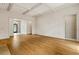 Spacious living room featuring hardwood floors, white walls, and a coffered ceiling at 5510 Conway Dr, Marietta, GA 30068