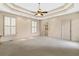 Spacious main bedroom features neutral decor, carpet, and tray ceiling at 5510 Conway Dr, Marietta, GA 30068