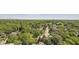Gorgeous aerial view of a tree-lined neighborhood with lush greenery and stunning city skyline views in the distance at 147 15Th Ne St # 16C, Atlanta, GA 30309
