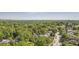 Beautiful aerial shot of a neighborhood with lush trees and skyline views offering a tranquil and scenic environment at 147 15Th Ne St # 16C, Atlanta, GA 30309