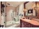 Updated bathroom featuring frameless shower, stylish vanity with ample lighting and storage at 147 15Th Ne St # 16C, Atlanta, GA 30309