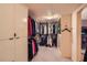Spacious walk-in closet with custom shelving and ample hanging space for organized storage at 147 15Th Ne St # 16C, Atlanta, GA 30309