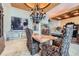 Elegant dining area showcasing travertine floors, chandelier, and sophisticated decor at 147 15Th Ne St # 16C, Atlanta, GA 30309