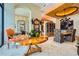 Open-concept dining area with travertine floors, custom lighting, and decorative round table at 147 15Th Ne St # 16C, Atlanta, GA 30309