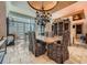Formal dining room with grand chandelier, travertine floors, and ornate decor at 147 15Th Ne St # 16C, Atlanta, GA 30309