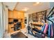 Bright home gym with full wall of built in shelving, fitness equipment, and space for a home office at 147 15Th Ne St # 16C, Atlanta, GA 30309