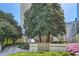 Beautiful apartment building exterior with manicured landscaping and an elegant entrance at 147 15Th Ne St # 16C, Atlanta, GA 30309
