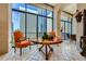 Bright living room features city views, stylish furnishings, and unique decor accents at 147 15Th Ne St # 16C, Atlanta, GA 30309