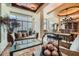 Open-concept living room with floor-to-ceiling windows offering city views and travertine flooring at 147 15Th Ne St # 16C, Atlanta, GA 30309