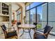 Elegant living room features city views, stylish furnishings, and an artistic sculpture at 147 15Th Ne St # 16C, Atlanta, GA 30309