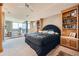 Spacious main bedroom with a large bed, built-in shelving, and floor-to-ceiling windows at 147 15Th Ne St # 16C, Atlanta, GA 30309