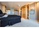 Bright and airy main bedroom featuring built-in storage and an arched doorway leading to the en suite at 147 15Th Ne St # 16C, Atlanta, GA 30309