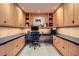 Well-lit home office features extensive built-in cabinetry, countertop space, and drawers at 147 15Th Ne St # 16C, Atlanta, GA 30309
