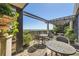 Inviting outdoor patio space with stone flooring, trellis, seating, and lush greenery offering stunning views at 147 15Th Ne St # 16C, Atlanta, GA 30309