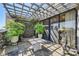 Charming outdoor patio area with stone flooring, trellis, and decorative planters, perfect for relaxing and entertaining at 147 15Th Ne St # 16C, Atlanta, GA 30309