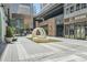 Modern plaza with public art, landscaping, and sleek buildings creating a vibrant urban space for gathering and leisure at 147 15Th Ne St # 16C, Atlanta, GA 30309