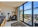 Well-appointed sunroom with floor to ceiling glass and seating area with access to private terrace at 147 15Th Ne St # 16C, Atlanta, GA 30309