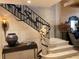 Unique staircase featuring custom iron railings, a stone angel, and stone steps at 147 15Th Ne St # 16C, Atlanta, GA 30309