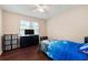 Bright bedroom with wood floors, a large window, and comfortable furniture at 174 Cannon Pl, Dallas, GA 30157