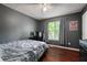 Cozy bedroom with wood floors, ample natural light, and modern decor at 174 Cannon Pl, Dallas, GA 30157