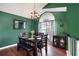 Charming dining room featuring warm colors, a chandelier, and ample natural light, perfect for hosting gatherings at 174 Cannon Pl, Dallas, GA 30157