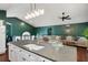 Open-concept kitchen and living area with stainless steel appliances and modern lighting at 174 Cannon Pl, Dallas, GA 30157