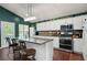 Stylish kitchen with granite countertops, stainless steel appliances, a center island, and plenty of storage at 174 Cannon Pl, Dallas, GA 30157