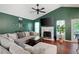 Comfortable living room with a fireplace and neutral color palette at 174 Cannon Pl, Dallas, GA 30157