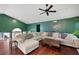Bright and airy living room featuring a large sectional couch and modern decor at 174 Cannon Pl, Dallas, GA 30157