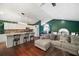 Open-concept living area and kitchen with hardwood floors at 174 Cannon Pl, Dallas, GA 30157