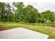 Expansive backyard with lush greenery, offers a perfect space for relaxation and entertainment at 1810 Forkview Ct, Lawrenceville, GA 30044