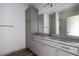 This bathroom has granite counters and plenty of storage space at 1810 Forkview Ct, Lawrenceville, GA 30044