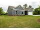 This home has blue siding, a garage, and a green lawn at 1810 Forkview Ct, Lawrenceville, GA 30044