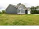 This home has blue siding, a garage, and a green lawn at 1810 Forkview Ct, Lawrenceville, GA 30044