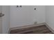 This laundry room features sleek wood floors and a convenient washer and dryer hook-up at 1810 Forkview Ct, Lawrenceville, GA 30044