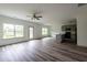 This living room has windows, an outside entrance, and connects to the kitchen at 1810 Forkview Ct, Lawrenceville, GA 30044